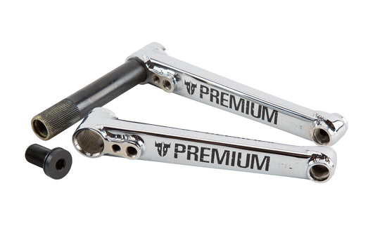 A pair of reflective silver bicycle crank arms, branded with PREMIUM, is included in the PREMIUM 2PC KURBELGARNITUR. It comes with a black assembly bolt and is designed for a 22mm Achse.