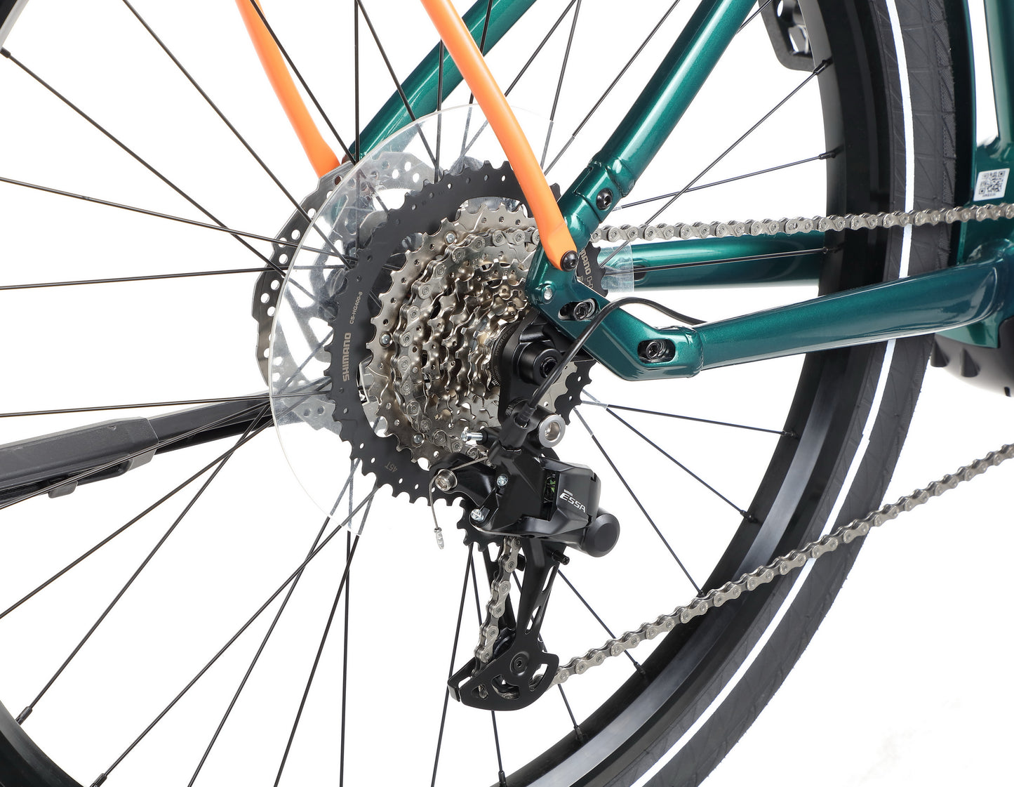 Close-up of the Haro Bikes Escondido 2’s rear wheel with gears, derailleur, chain, Bosch Active Line Plus Motor, and green-orange frame.