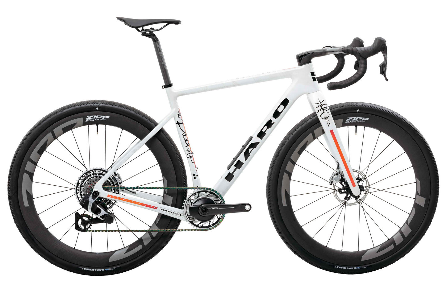 White Haro Buzzard Carbon “Desert Sunset” frameset, drop bars, Zipp wheels, black accents—custom style for the road.