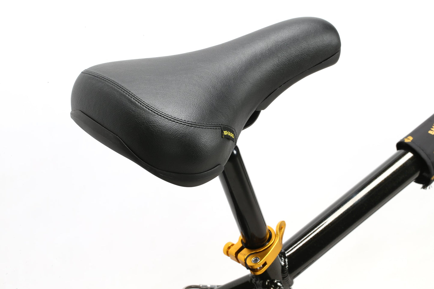 Haro Bikes B.M.F seat with black leather, black post, and gold clamp on a white background, perfect for ride-outs.