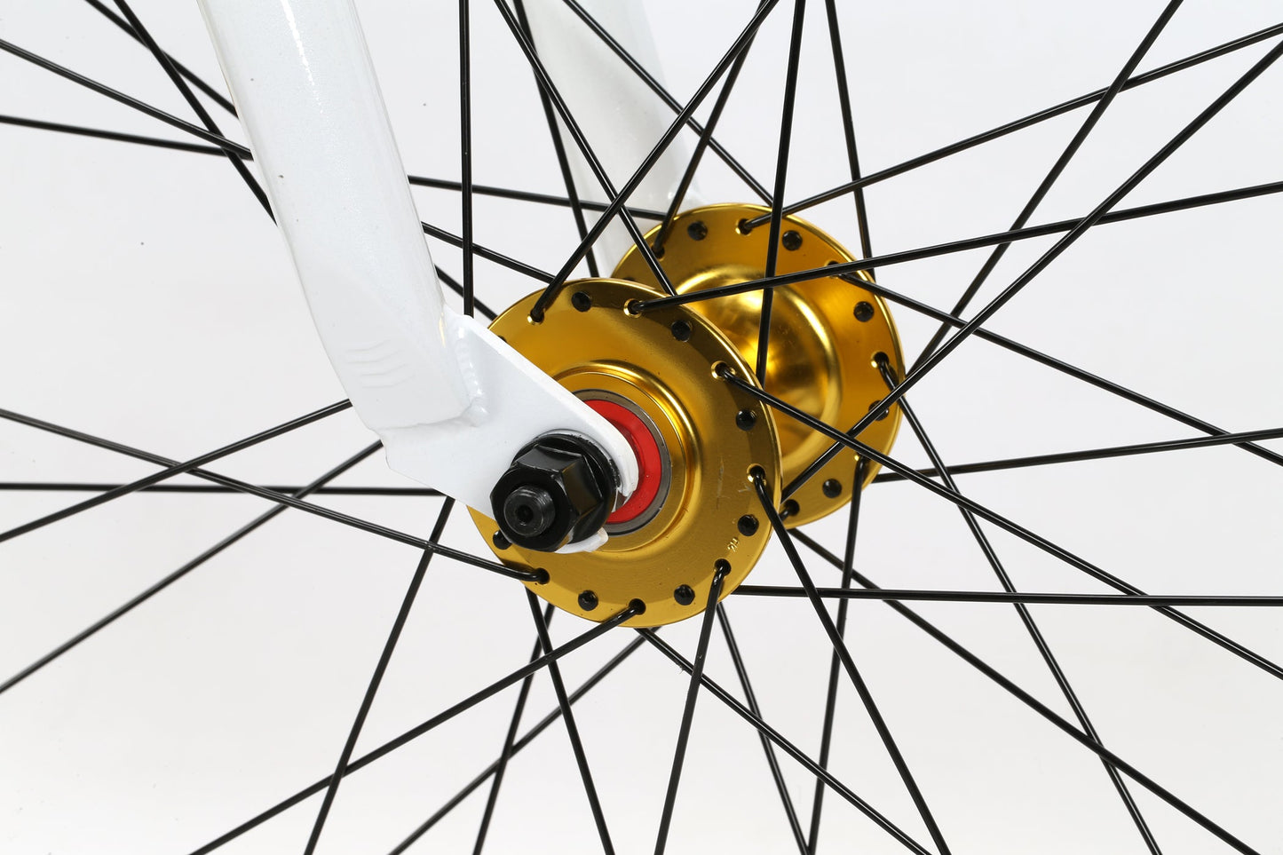 The Haro Bikes B.M.F features a gold wheel hub with black spokes and a white fork with a bolt.