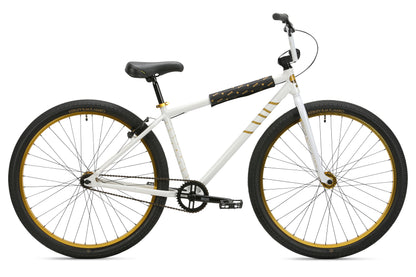 The B.M.F by Haro Bikes is a pearl white BMX with gold accents, large wheels, black seat and handlebars, single-speed sleek design for ride-outs.