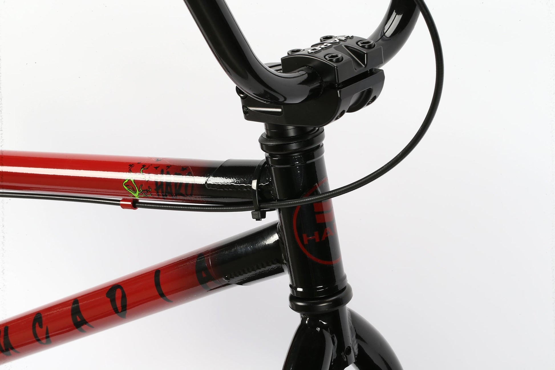 Close-up of the Leucadia BMX frame by Haro Bikes in black and red, with Hi-Ten-Stahlrahmen, visible cables, and brand logo.