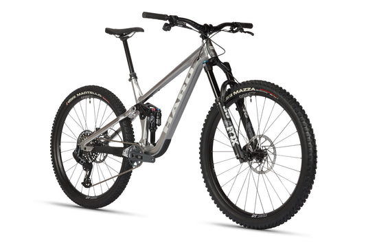 A sleek Haro Bikes Daley Alloy LTD 1 mountain bike in silver with black and red accents is shown against a white background, featuring a sturdy frame, Fox suspension, and rugged tires.