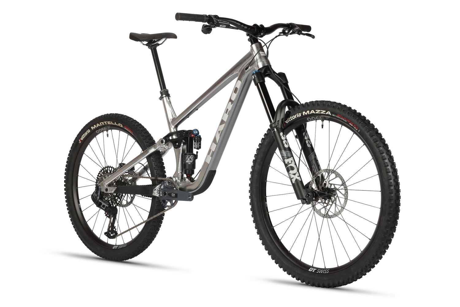 The Greer Alloy LTD 1 by Haro Bikes is a stylish mountain bike with a raw aluminum frame, large black tires, and a Fox suspension fork. It features disc brakes and a gear system, making it ideal for off-road adventures.