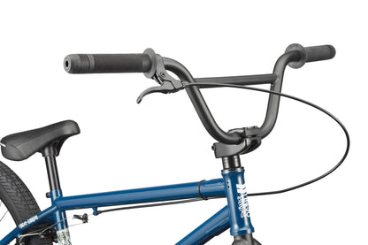 Close-up of a Haro Bikes Downtown 24 BMX, showing handlebars, brake lever, seat, and top of the frame.