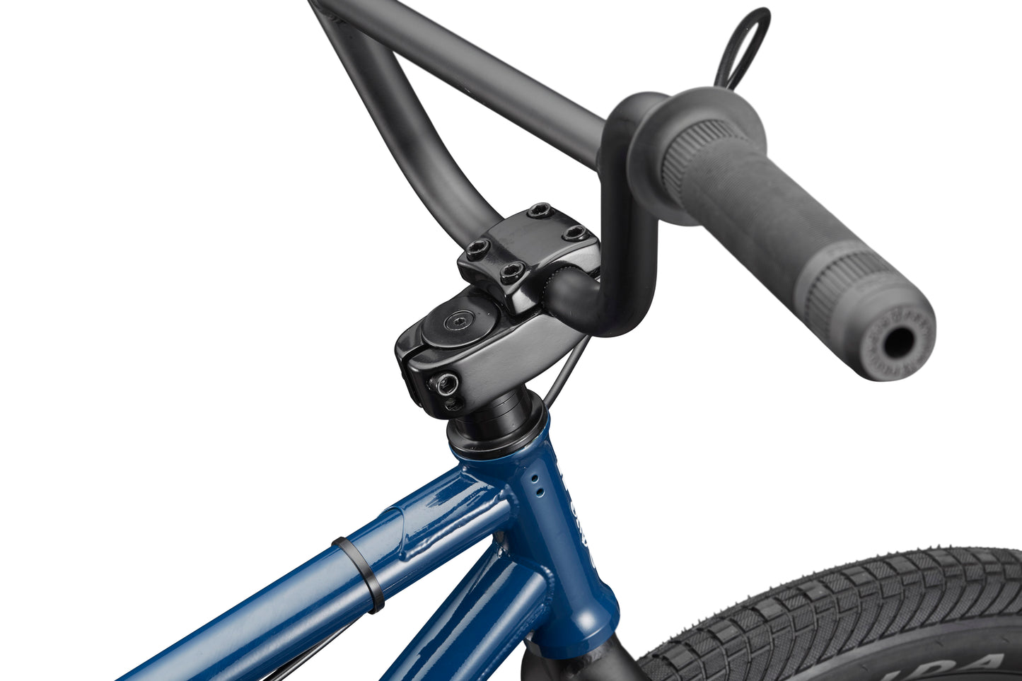 Close-up of the Haro Bikes Downtown 24 BMX, highlighting its blue handlebars, stem, and front tire against a white background.