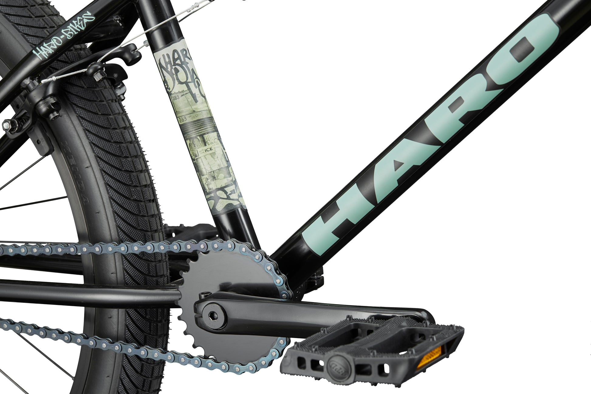 Close-up of a versatile Haro Bikes Downtown 24 BMX frame, showing the pedal, chain, rear wheel, and 24" wheels.