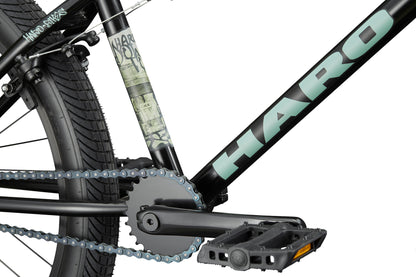 Close-up of a versatile Haro Bikes Downtown 24 BMX frame, showing the pedal, chain, rear wheel, and 24" wheels.