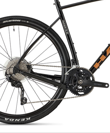 Black Buzzard Alloy LTD 2 road bike by Haro Bikes, with drop handlebars, hydraulic disc brakes, Kenda tires, and Shimano RX400 Gravel gear system.