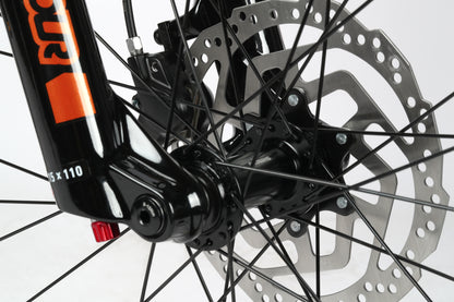 Close-up of Double Peak 2s front disc brakes and spokes, showcasing a black fork with orange decals by Haro Bikes.