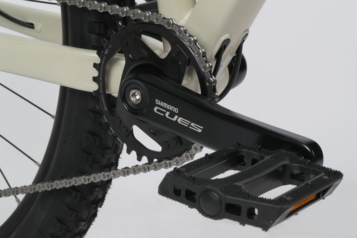 Close-up of a Shimano Cues 1x10 pedal and chainring on an aluminum black & white Haro Bikes Double Peak 2 frame.