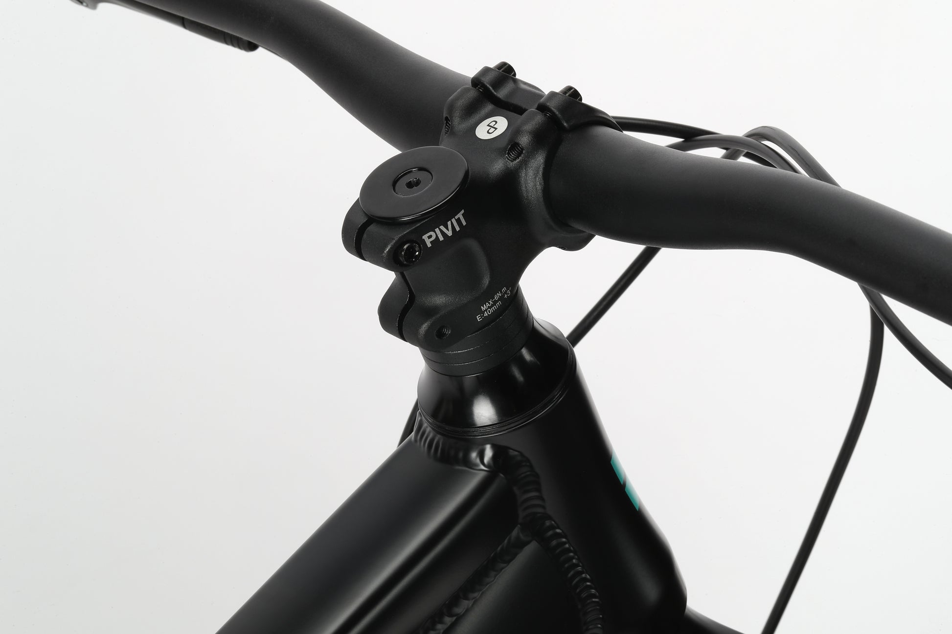 Close-up of the Double Peak 3s black handlebar and stem from Haro Bikes on a white background.