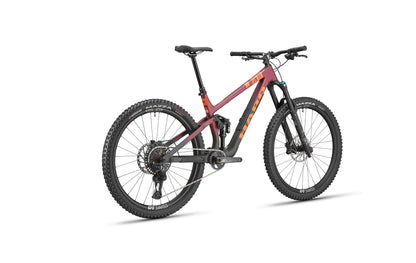 The Haro Bikes Daley Carbon 1, a matte red full-suspension All-Mountain Bike, is shown rear-side on a white background.