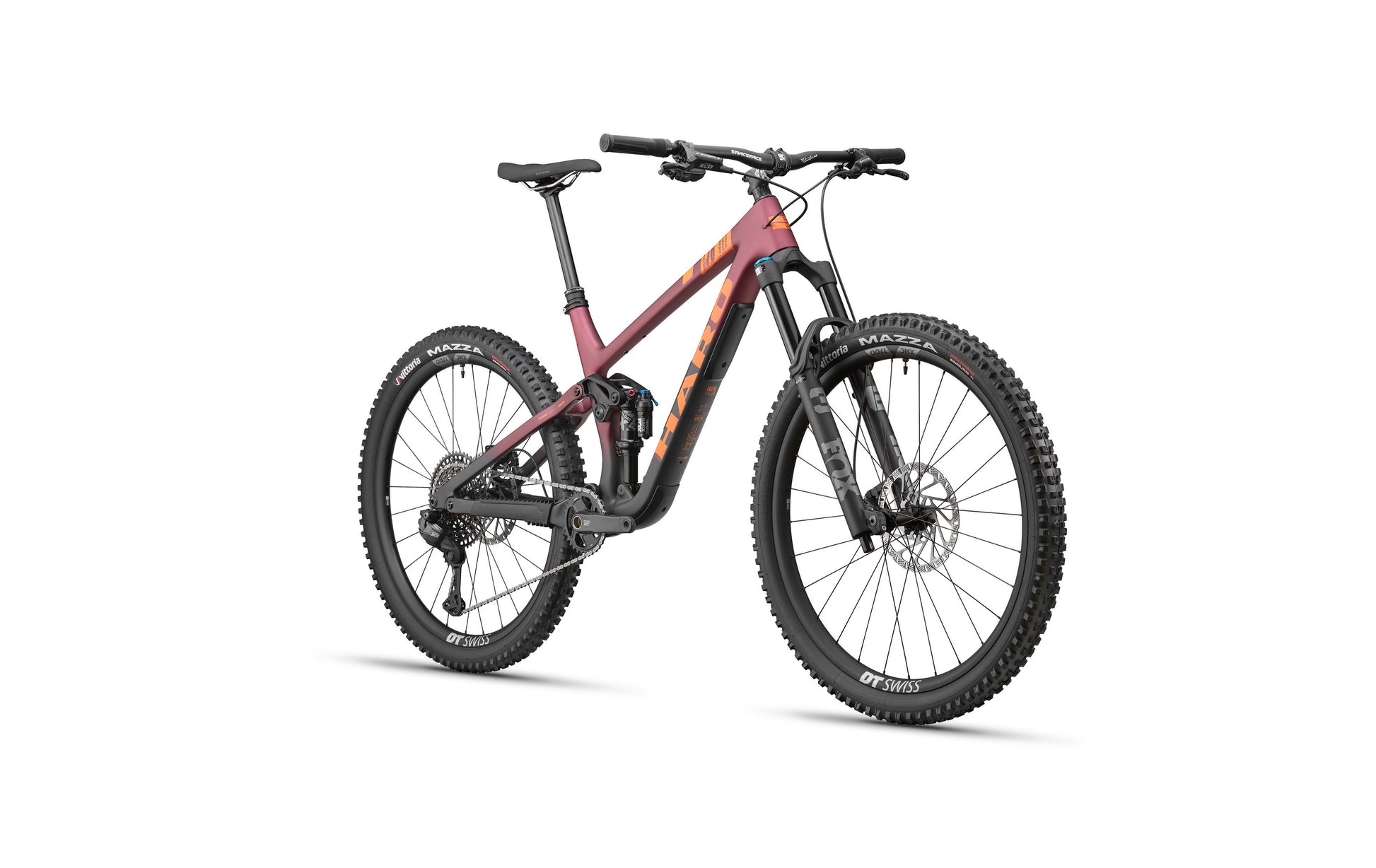 The Haro Bikes Daley Carbon 1 is a modern full-suspension All-Mountain bike with thick tires and a matte maroon and black frame.