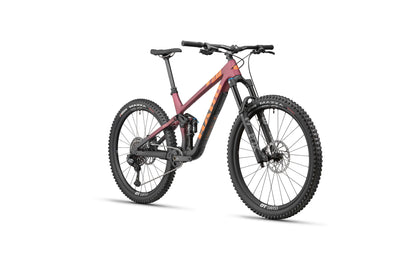 The Haro Bikes Daley Carbon 1 is a modern full-suspension All-Mountain bike with thick tires and a matte maroon and black frame.