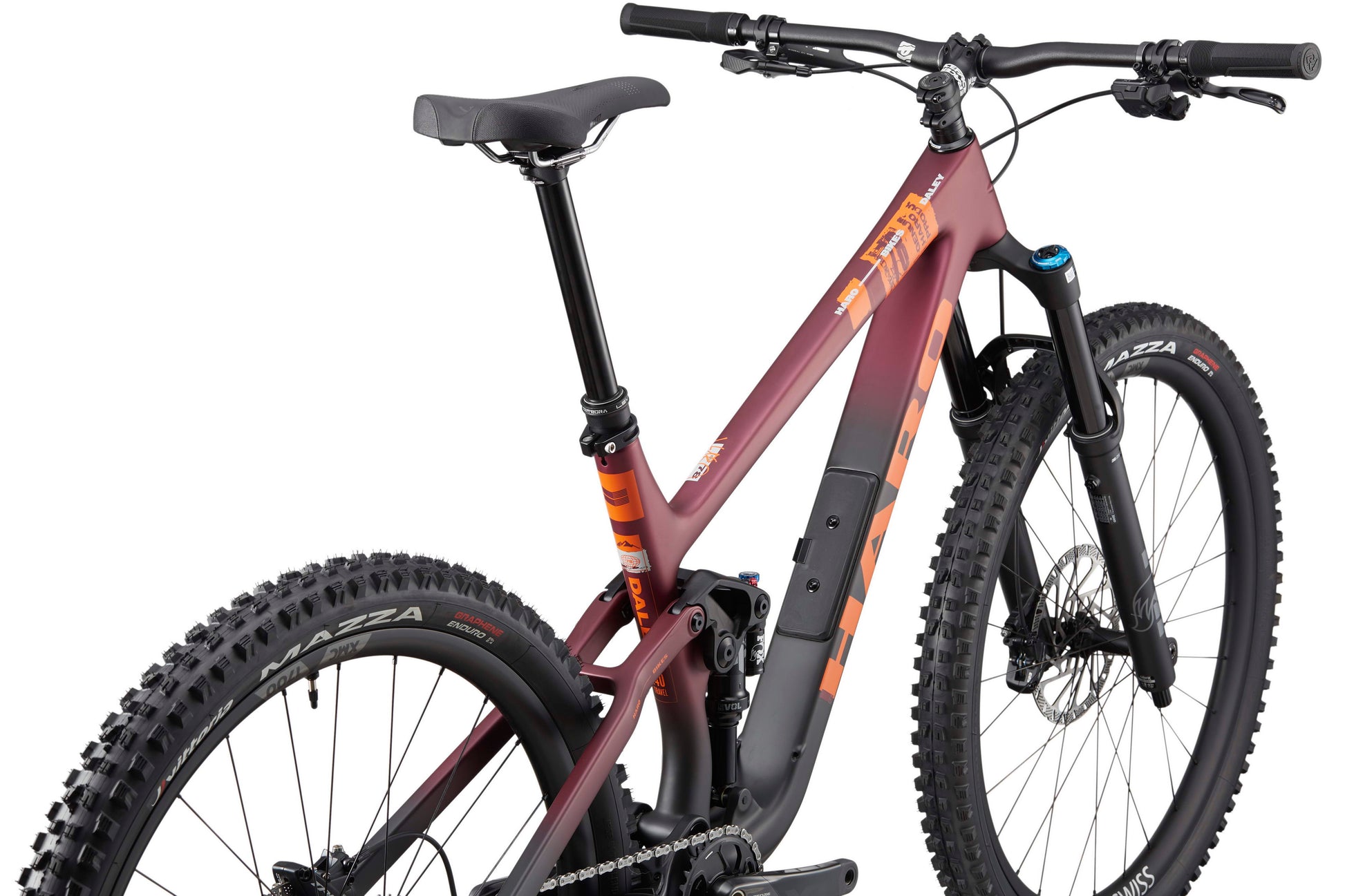 The Haro Bikes Daley Carbon 1, in maroon and orange, features thick tires and a front suspension fork, shown from the rear side.