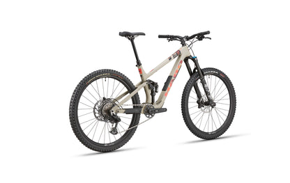 The beige and black Haro Bikes Daley Carbon 3 features disc brakes, suspension, and a lightweight carbon frame against a white background.