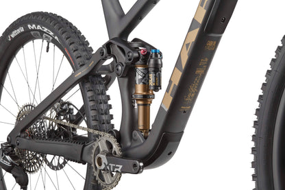 Close-up of the Haro Bikes Daley Carbon Top Shelf’s rear suspension, carbon frame, and high-end components with detailed parts visible.