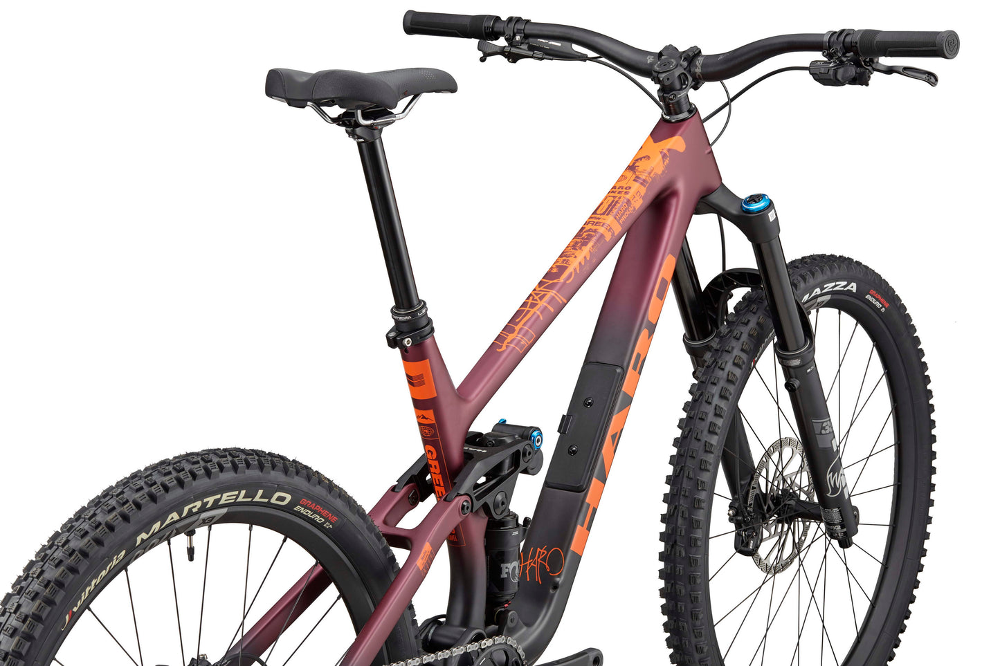 A maroon and orange Haro Bikes Greer Carbon 1, shown from the side with Fox suspension, large knobby tires, and a front suspension fork.