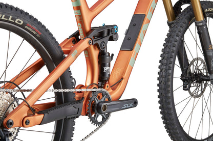 Close-up of the Haro Bikes Greer Carbon 2 frame, Shimano SLX drivetrain, rear suspension, front wheel, and fork.