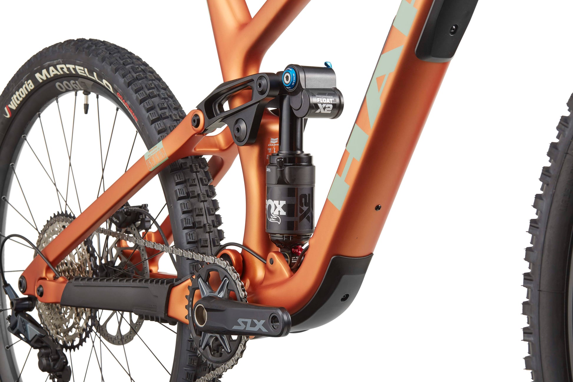 Close-up of the Haro Bikes Greer Carbon 2 enduro frame, highlighting crankset, rear suspension, and rear wheel.