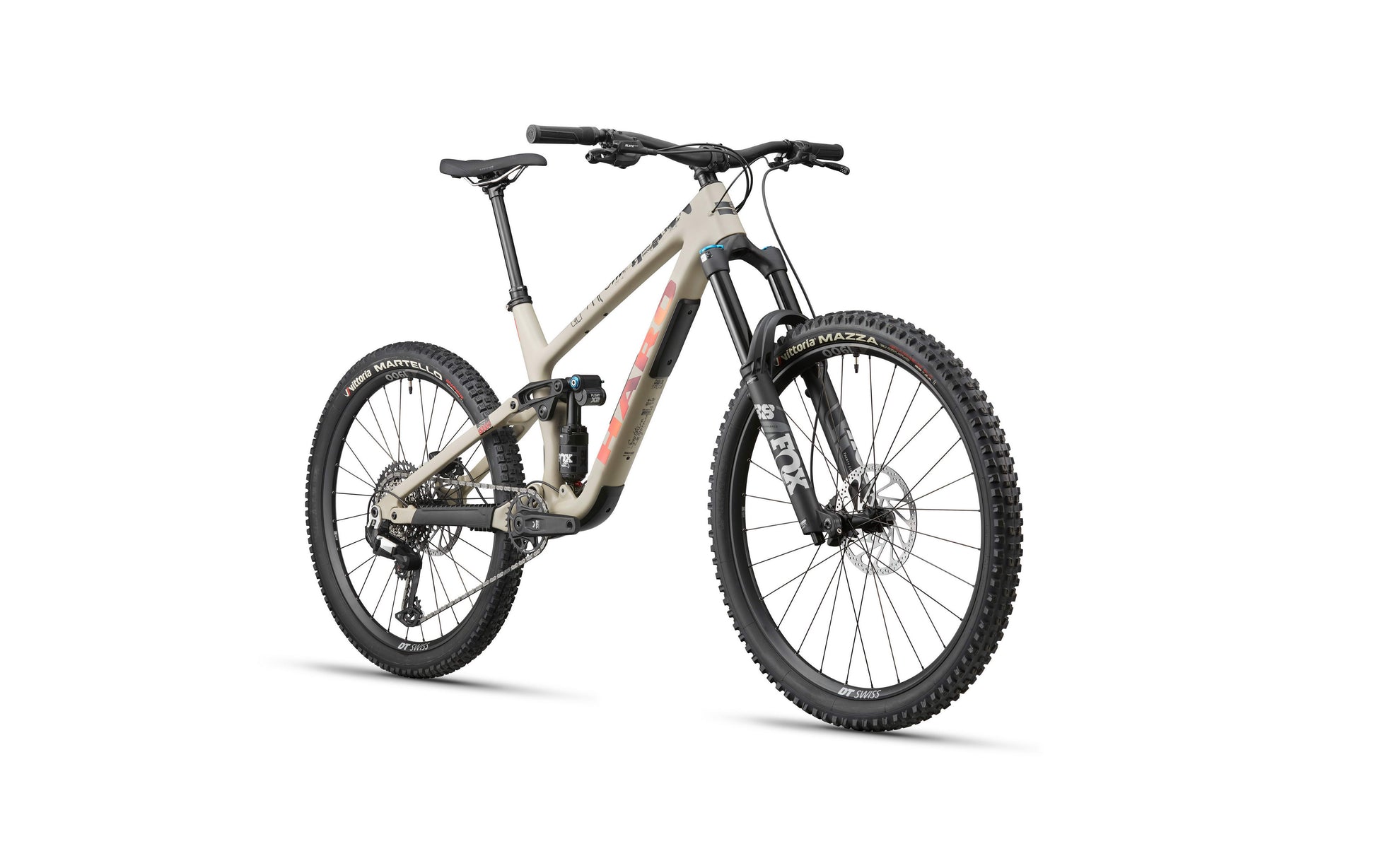 The Haro Bikes Greer Carbon 3 is a full-suspension enduro bike with disc brakes, thick tires, and a tan frame on white background.