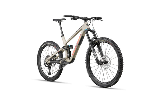 The Haro Bikes Greer Carbon 3 is a full-suspension enduro bike with disc brakes, thick tires, and a tan frame on white background.