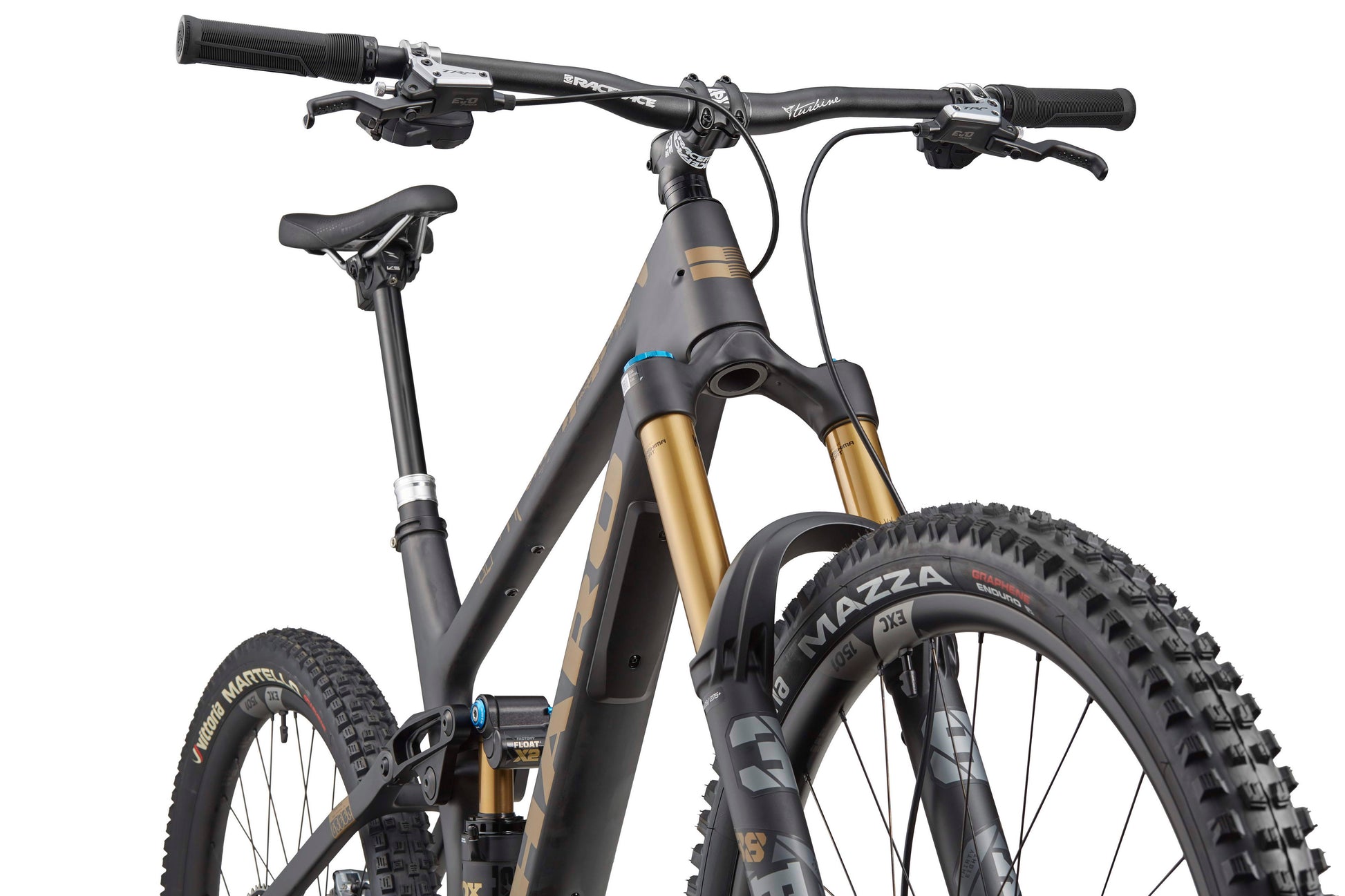 Close-up of a Haro Bikes Greer Carbon Top Shelf, highlighting its carbon mountain bike frame, handlebars, and Fox 38 Float Factory fork.