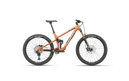 The Daley Carbon 2 by Haro Bikes: orange all-mountain carbon bike with Fox suspension, Shimano SLX, disc brakes, black tires on white.