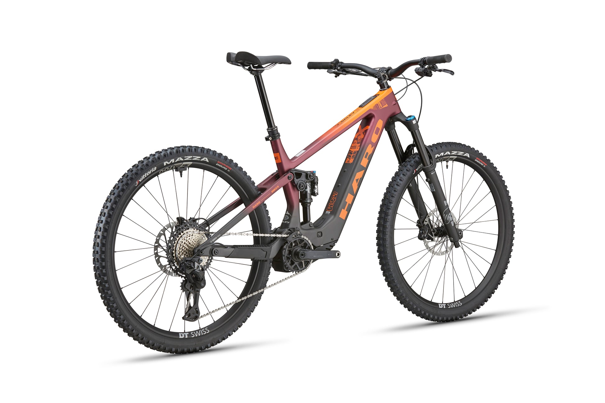The Haro Bikes eDaley Carbon 1 is a full-suspension carbon e-bike in maroon/orange with Bosch SX motor, black wheels, and disc brakes.