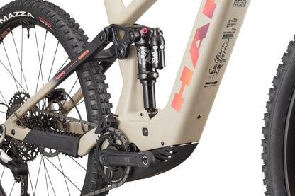 Close-up of the eDaley Carbon 3’s rear suspension, drivetrain, and carbon frame with bold Haro Bikes branding and signature.