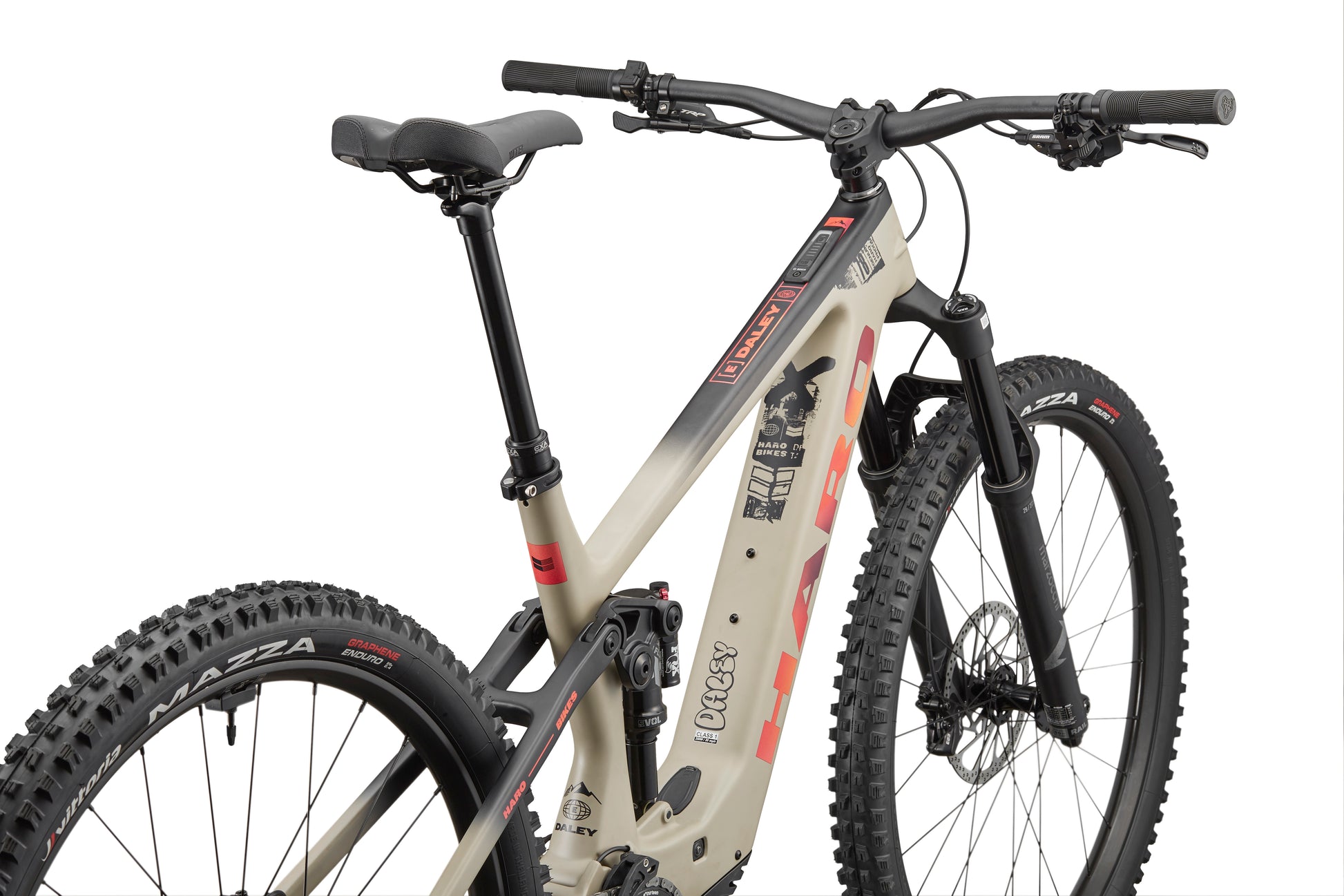 The Haro Bikes eDaley Carbon 3 E-MTB in beige/black, with thick tires, rear suspension, and flat bars, seen left-rear on white.