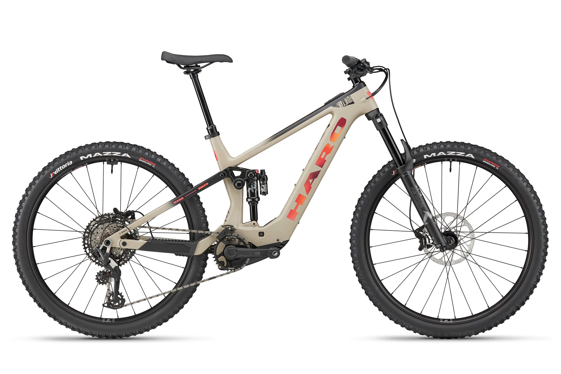 The Haro Bikes eDaley Carbon 3 E-MTB in tan and black with carbon frame, full suspension, and disc brakes, side view on white.