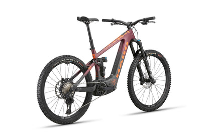 The Haro Bikes eGreer Carbon 1 is an Enduro E-Bike with thick tires, red/black frame, Bosch CX motor, and FOX Factory suspension.