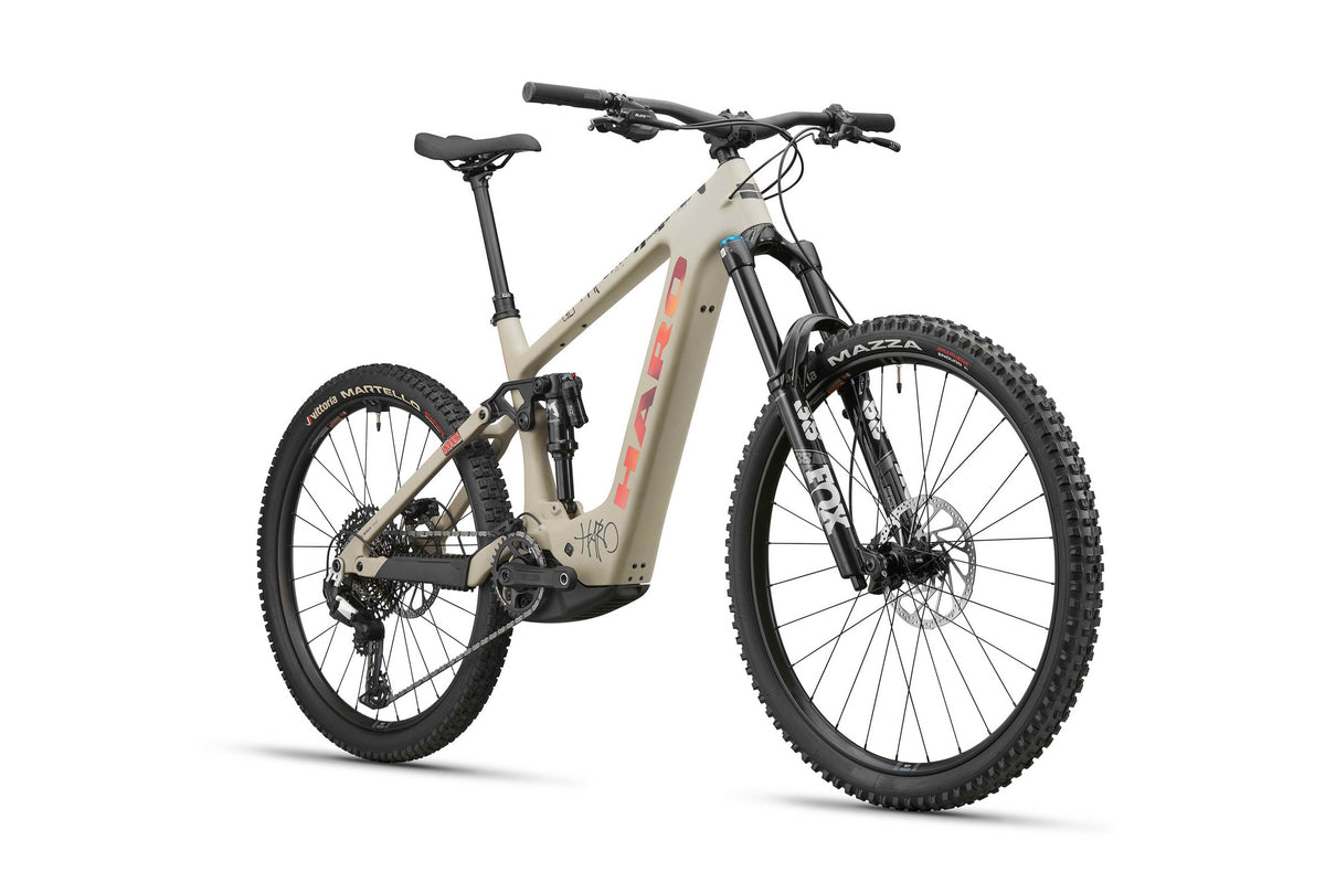 Beige eGreer Carbon 3 by Haro Bikes: Bosch Performance Line CX, thick tires, full suspension, angled frame branding.