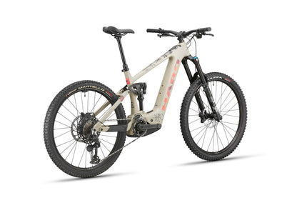 Haro Bikes eGreer Carbon 3: Beige e-mountainbike with Bosch CX, thick tires, black seat, red accents, rear-side view.