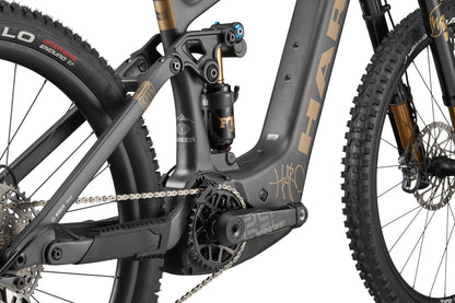 Close-up of Haro Bikes eGreer Carbon Top Shelf’s carbon frame, gears, chain, and Bosch Performance Line CX branding in detail.