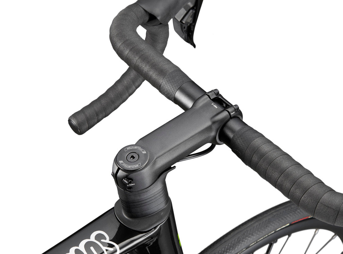 Close-up of HARO Partimos Alloy’s handlebar, stem, headset with wrapped grips and part of the aluminum bike frame.