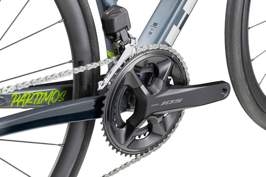 Close-up of HARO Partimos Alloy crankset, chainring, and chain with Shimano 105 Di2 details on the frame.