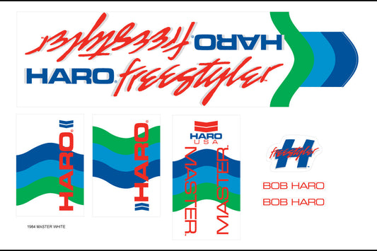 A sheet of 1984 Decals Master White featuring various logos, text, and wave patterns in blue, green, and red on Mylar material.