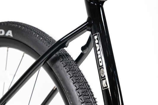 Close-up of a Haro Buzzard Alloy LTD 2 bicycle frame showing the seat tube and rear tire.