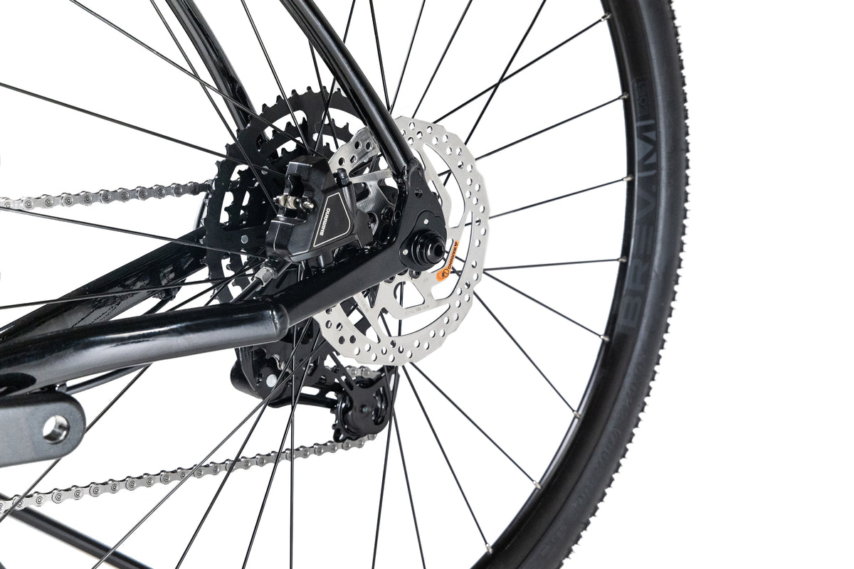 Close-up of a Haro Bikes Buzzard Alloy LTD 2 rear wheel showing the Shimano RX400 disc brake, gear cassette, and derailleur.