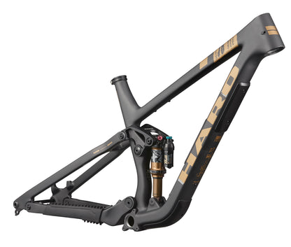 Matte black and gold Daley Carbon Frameset by Haro Bikes with visible shock absorber and full-suspension design.