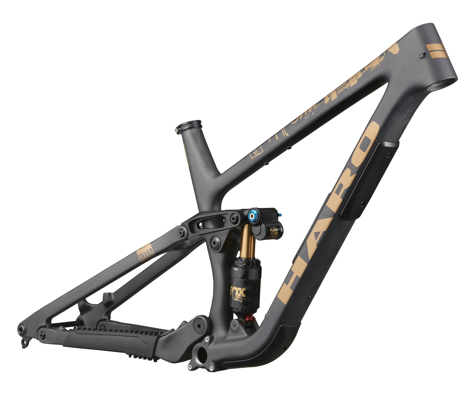 The Haro Bikes Greer Carbon Frameset in matte black and gold, side view, highlights its progressive geometry and rear shock absorber.