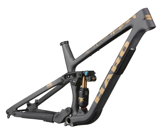 The Haro Bikes Greer Carbon Frameset in matte black and gold, side view, highlights its progressive geometry and rear shock absorber.