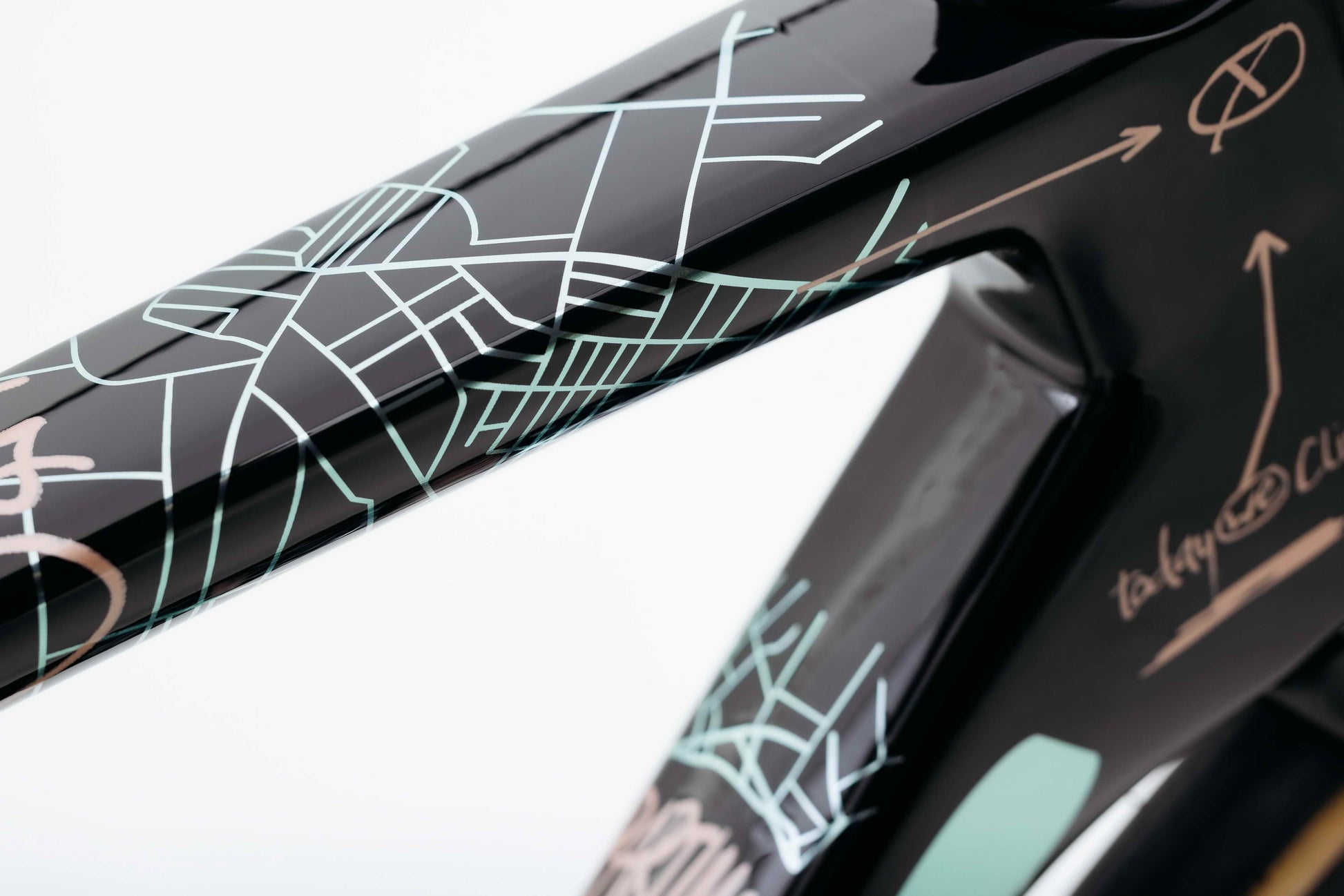 Close-up of Haro Bikes Partimos Carbon Custom "Grid" frame, with abstract city map art on glossy black carbon surface.