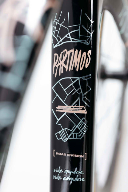 Close-up of Haro Bikes’ Partimos Carbon Frameset “Grid” with geometric designs and “ride anywhere. ride everywhere.”.