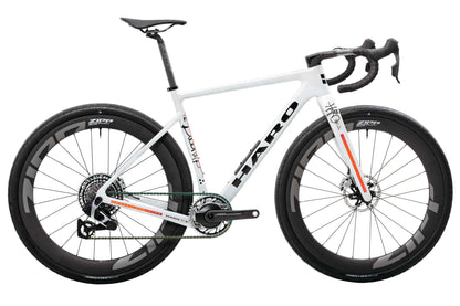 White Haro Buzzard Carbon “Desert Sunset” frameset, drop bars, Zipp wheels, black accents—custom style for the road.