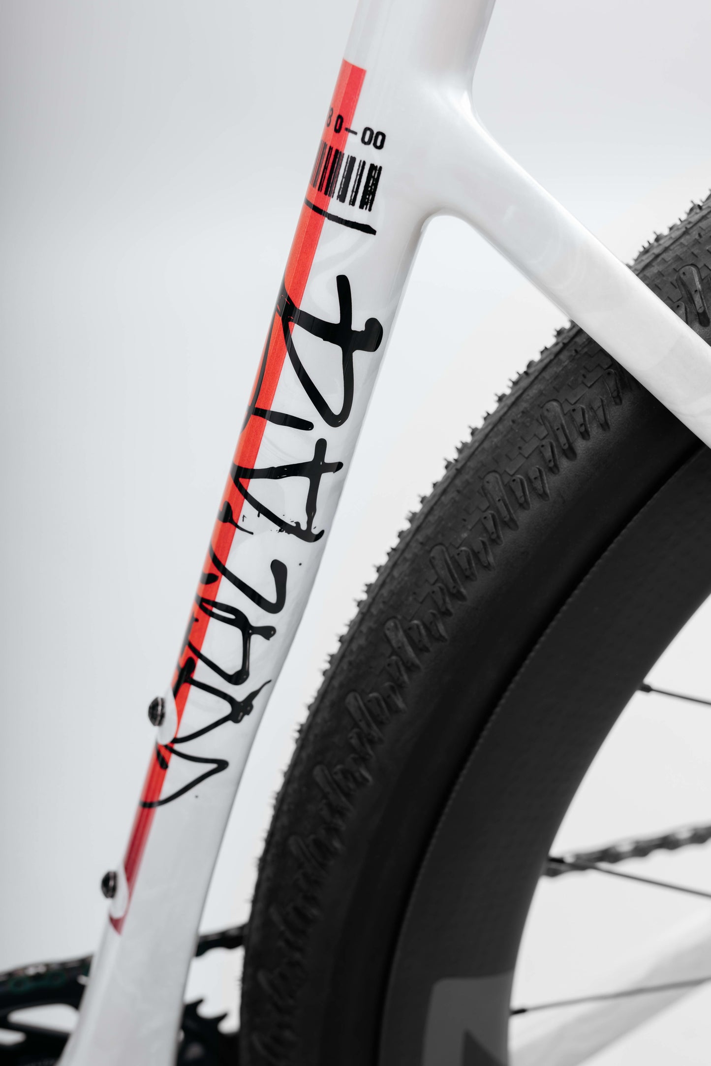 Close-up of a Buzzard Carbon Custom “Desert Sunset” frame by Haro Bikes with a large rear tire—ideal for Gravel Bike fans.